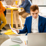 Employee checking a UK tax code on a payslip